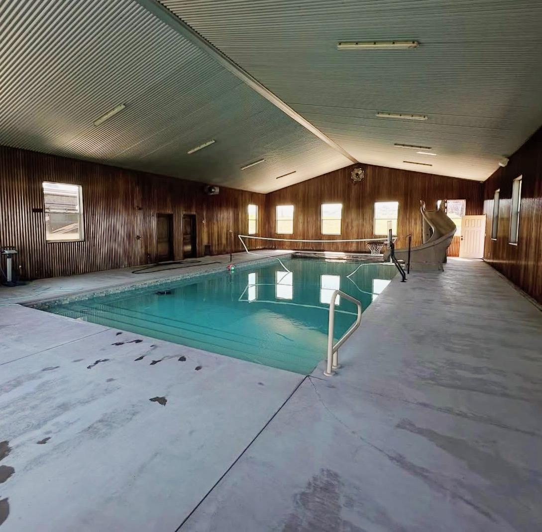 Indoor pool with a water slide at the lodge